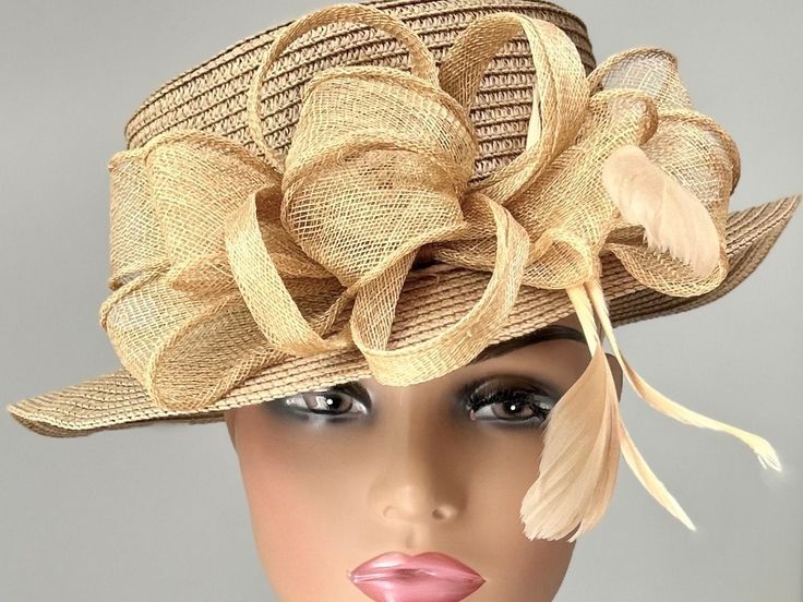 "The featured hat is a tan straw hat. It is adornef with a creation in tan Sinamay of flowers, petal, swirls and loops. This classic hat is a beautiful Kentucky Derby Hat.  Also perfect  for  Sunday  Church hat, Easter Hat, Tea Party hat, Wedding Party Hat, Downton Abby Hat,Auntie Hat , Fancy Dress Hat for all formal events and other special occasions. Brim:   2\" Rise:   4\" Size:   22\"" Kentucky Derby Straw Sun Hat With Upf 50+, Straw Sun Hat For Garden Party & Kentucky Derby, Beige Straw Hat For Kentucky Derby, One Size, Luxury Cream-colored Hat Headpiece, Vintage Cream Wide-brim Straw Hat, Retro Hat, Hat Tea Party, Easter Hat, Sunday Church