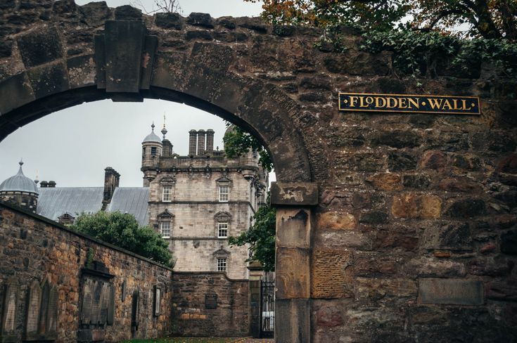 an old stone building with a sign on it that says peddden wall in the middle