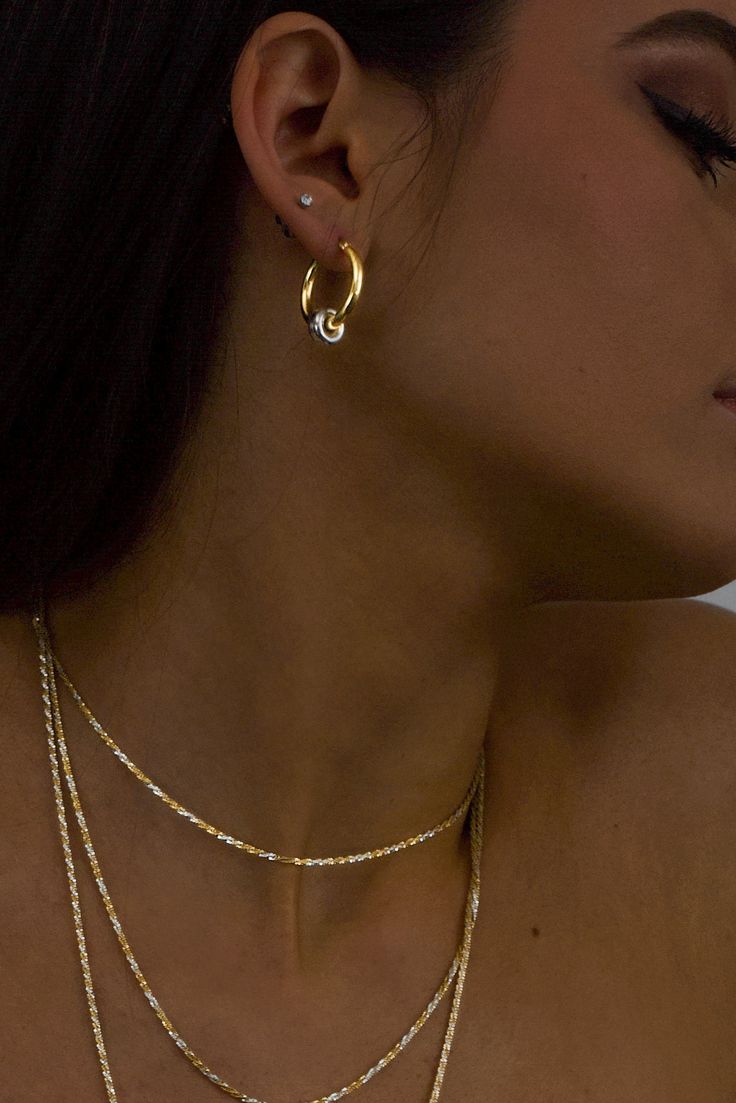 The classic gold hoop reinvented. Crafted in high polish 18K Gold vermeil with sterling silver accent, the Greyson hoops are a staple in the Hydez Essential Collection. These sophisticated head-turners will luxe up any look. Our two tone design means you’ll never have to choose between gold and silver.Materials: 18K Gold Vermeil and Sterling SilverDimensions: 20mm hoop, 3mm width What is 18K Gold Vermeil?: 3 microns of 18K Gold over Sterling Silver. Vermeil is far more durable to wear than tradi Gold Tarnish Resistant Hoop Earrings, Gold Plated White Gold Huggie Earrings, Timeless Gold Huggie Earrings With Diamond Cut, Timeless Gold Diamond Cut Huggie Earrings, Gold Tarnish-resistant Fine Jewelry Hoop Earrings, Hallmarked Hoop Jewelry For Everyday, Classic Plated Hoop Jewelry, Everyday Hallmarked Hoop Jewelry, Gold Sterling Silver Hoop Earrings