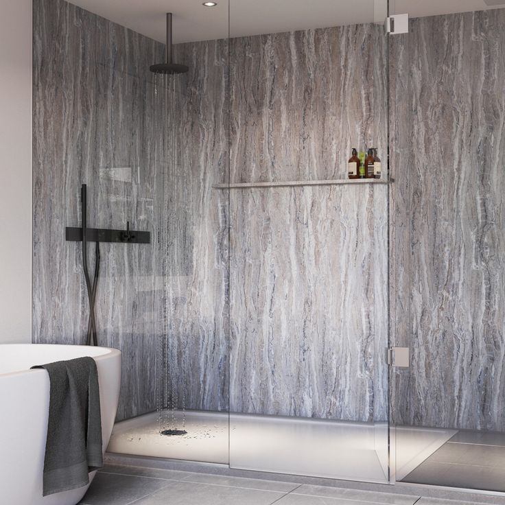 a modern bathroom with marble walls and floor