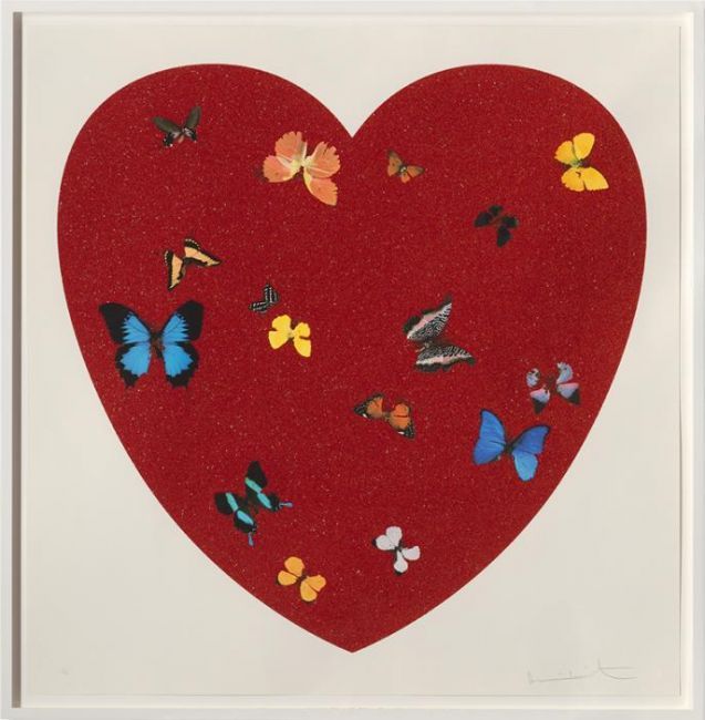 a red heart with many butterflies on it