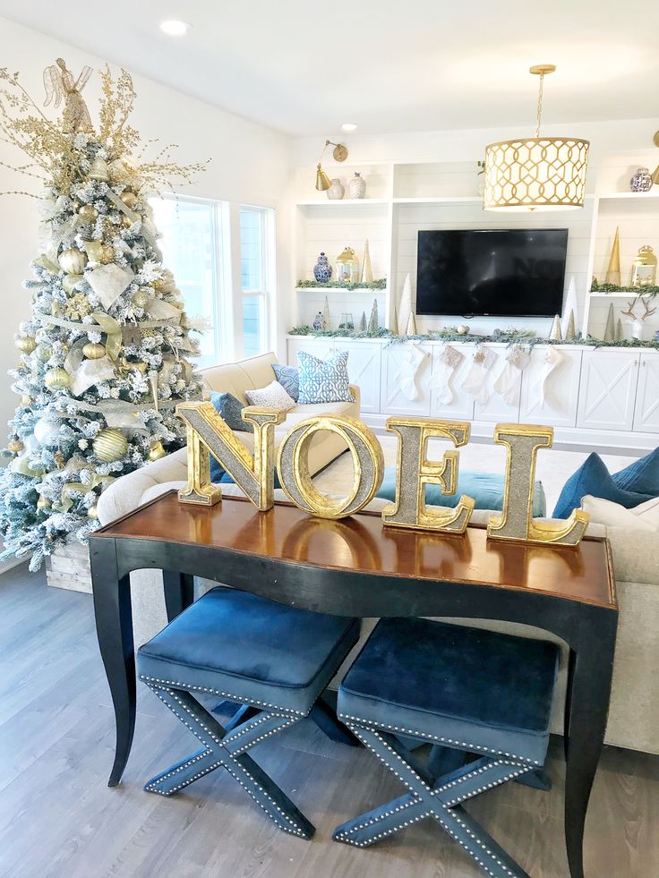 a living room with a christmas tree and decorations