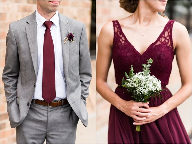 a man in a suit and tie standing next to a woman in a red dress