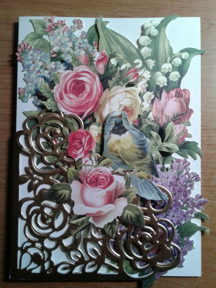 a card with flowers and birds on it