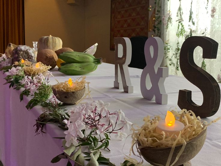 the table is set up with flowers and candles