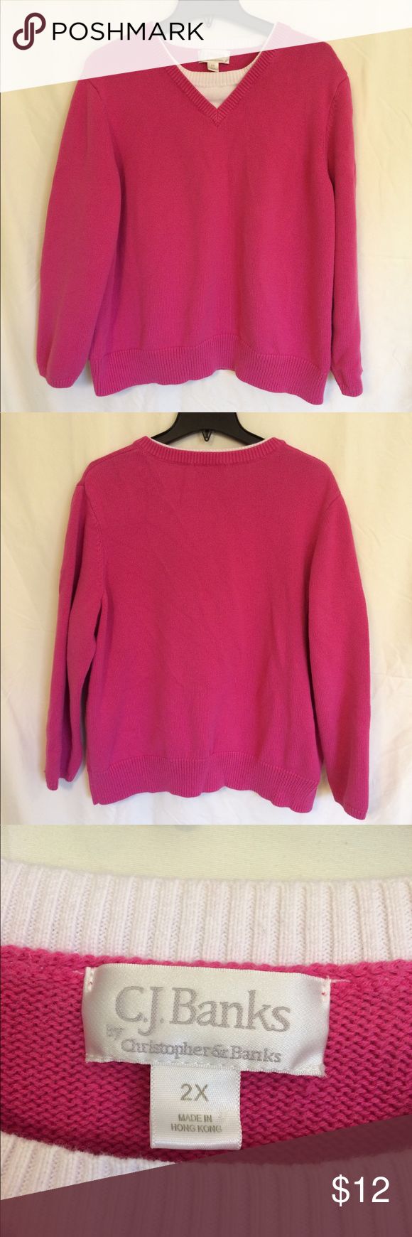 two pink sweaters are on display for sale