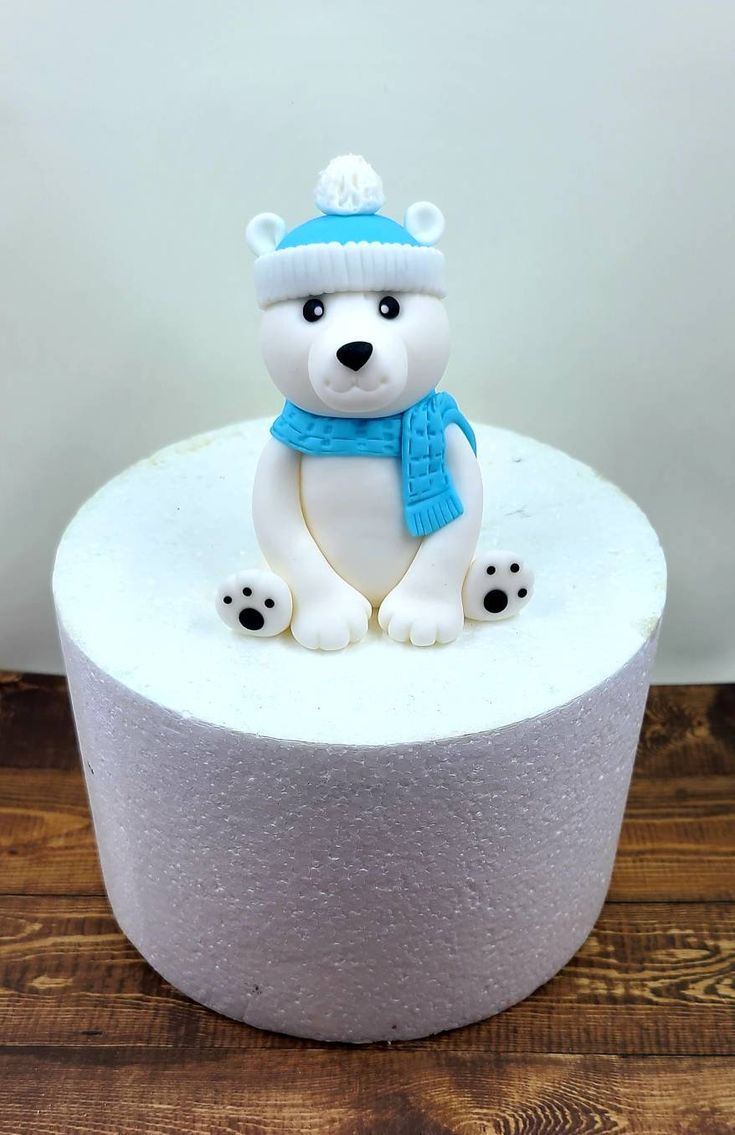 a white cake with a polar bear on top