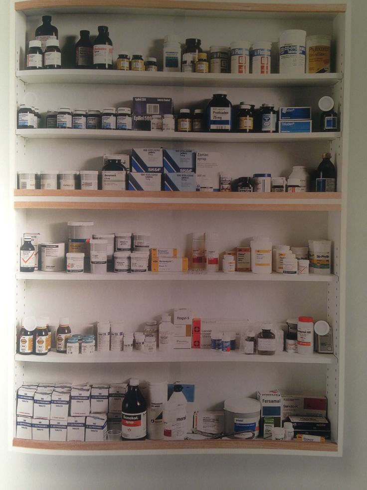 the shelves are filled with many different types of medicine