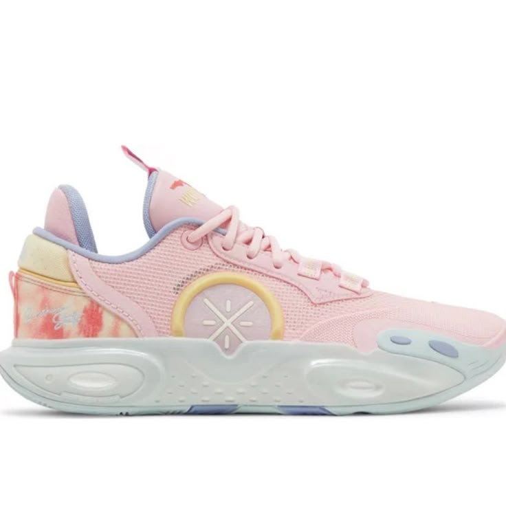 a pink and yellow sneaker with floral print on the upper part of the shoe