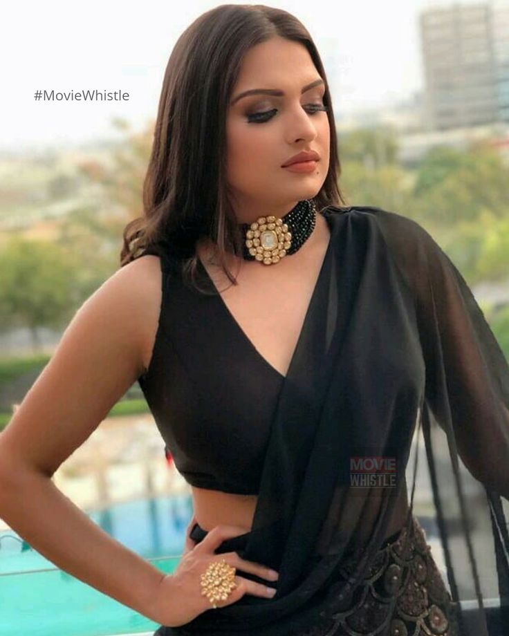 In a black sheer saree and sleeveless blouse design Saree And Sleeveless Blouse, Black Saree Blouse Designs, Saree Sleeveless, Sheer Saree, Bridal Outfit Ideas, Black Blouse Designs, Saree Jacket Designs, Sleeveless Blouse Designs, Saree Jackets