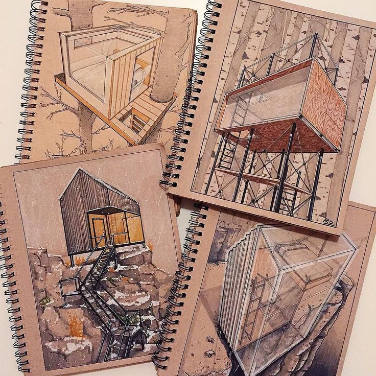 four notebooks with drawings of buildings on them