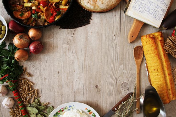 a table topped with lots of different types of food next to bowls and spoons