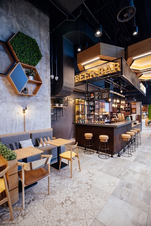 the inside of a restaurant with tables and chairs