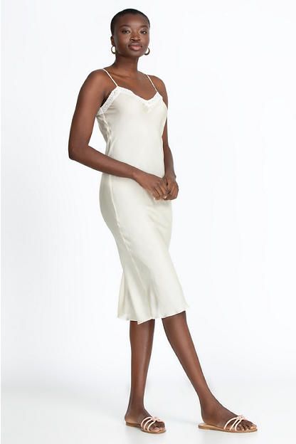 Expertly crafted from 100% silk, the Midi Length Slip is an essential piece with a touch of audacity. The midi length gives this dress an elegant silhouette that is ideal for versatile day-to-evening styling. Layer under a sheer top for additional coverage or wear as a stand-alone slip dress for a luxe going-out look. Johnny Was Women's Midi Length Slip in Ecru White, Size XS, 100% Silk Classic Knee-length Silk Midi Dress, Knee-length Bias Cut Midi Dress For Date Night, Elegant Fitted Silk Daywear Dress, Elegant Fitted Silk Dress For Daywear, Elegant Off White Satin Dress, Spring Silk Knee-length Slip Dress, Chic Cream Slip Dress For Formal Occasions, Feminine Silk Daywear Dress, Chic Cream Silk Midi Dress