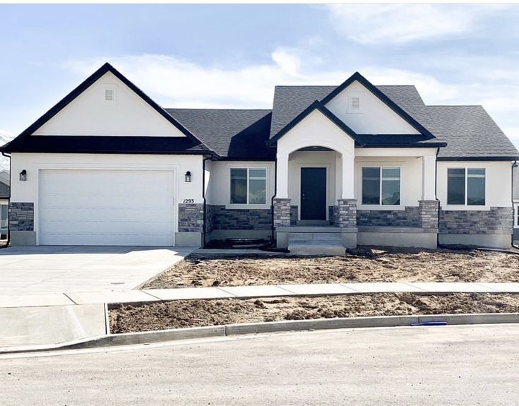 a house that is in the middle of some dirt