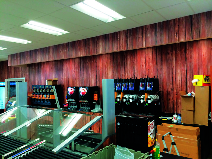 the inside of a store filled with lots of machines and boxes on display in front of them