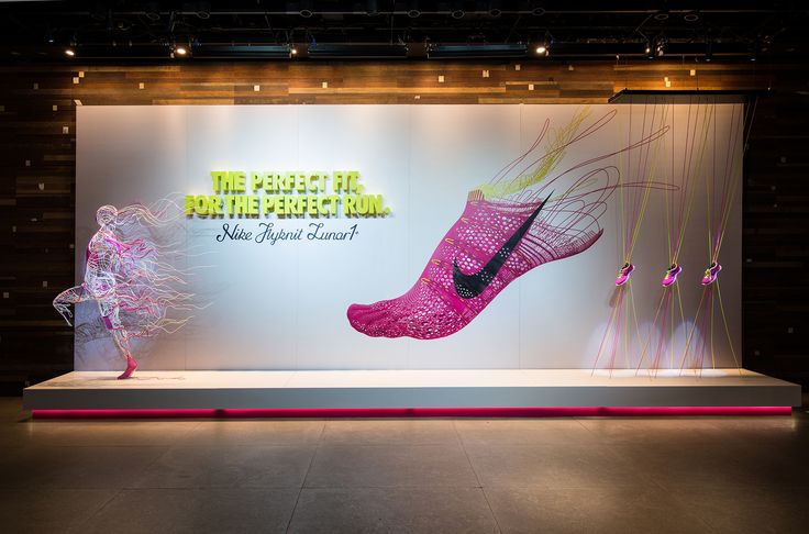 a display with pink shoes and neon lights