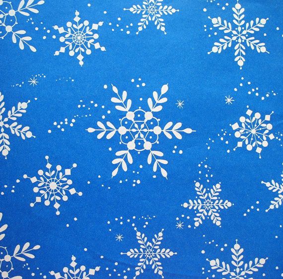 a blue background with white snowflakes and stars on it's edges is shown