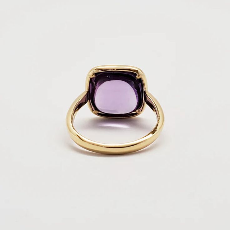 PURPLE PARADISE WHAT IT IS: 18k yellow gold ring with amethyst 9.5 cts WHY IT’S SPECIAL: Exquisite in its design, this ring elevates the concept of simplicity and sophistication to the highest level. Surrounding the finger is an 18k yellow gold band, with a mesmerizing cushion-cut amethyst at its heart. Truly enchanting... GOOD TO KNOW: 18k yellow gold 3.05 gmsAmethyst 9.5 ctsRing Size: 7 WHY WE LOVE DORIAN WEBB: We can't take our eyes off Dorian Webb's purposeful creations that honor women, emb Luxury 14k Gold Purple Rings, Luxury Purple 14k Gold Rings, Timeless Purple 14k Gold Rings, Luxury Solitaire Amethyst Ring, Yellow Gold Amethyst Ring With Center Stone, Yellow Gold Amethyst Ring With Round Cut, Amethyst Yellow Gold Rings Fine Jewelry, Fine Jewelry Amethyst Ring In Yellow Gold, Hallmarked Yellow Gold Amethyst Ring