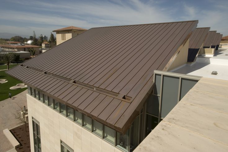 an aerial view of a house with a metal roof