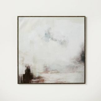 an abstract painting hangs on the wall