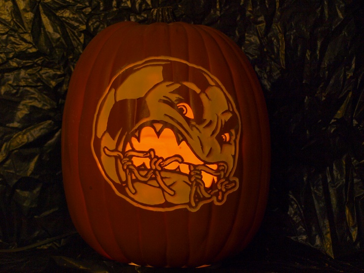 a carved pumpkin with an image of a dog on it