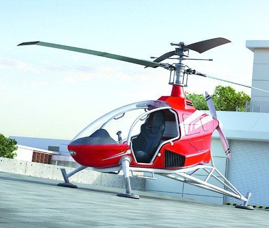 a red helicopter sitting on top of an airport tarmac next to a tall building