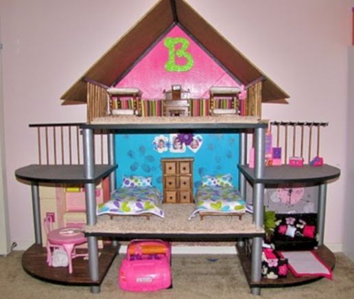 a doll house with furniture and accessories inside