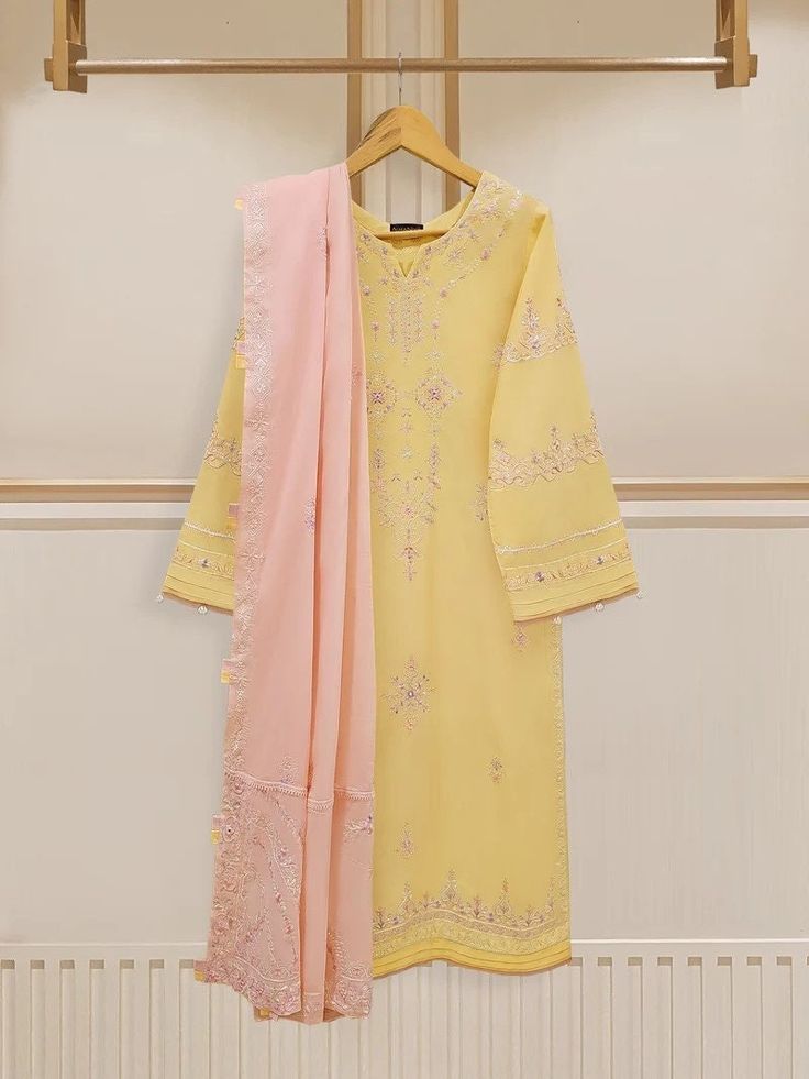 Vibrant and fashionable embroidered lawn shirt with dupatta perfect for adding a touch of elegance and style to your wardrobe. Made from high-quality lawn fabric, this shirt offers comfort and breathability, making it an ideal choice. Length : 46" Dupatta Fabric : Lawn Yellow Anarkali Unstitched Suit With Naqshi Detail, Anarkali Unstitched Yellow Suit With Naqshi Details, Yellow Naqshi Lawn Suit For Wedding, Yellow Lawn Suit With Naqshi For Wedding, Designer Embroidered Lawn Suit In Nida, Semi-stitched Yellow Kurta With Naqshi, Designer Embroidered Lawn Suit, Unstitched Yellow Lawn Suit With Naqshi, Semi-stitched Chinon Lawn Suit With Naqshi Details