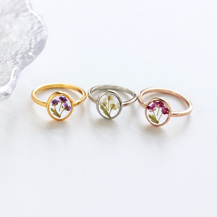 Pressed Flower Rings | Handmade Real Flower Rings | Christmas Gift | Bridesmaid Gifts | Birthday Gift for Mom | Resin Gift | Gift for Her ✨️The Pressed Flower Rings are beautiful and delicate pieces of jewelry that are handcrafted with love and attention to detail. Each ring features a real pressed flower that is carefully encased in a clear resin, preserving its natural beauty and vibrant colors. These rings make for stunning accessories, adding a touch of nature-inspired elegance to any outfit. -------------------------------------------------- ✨️ H I G H L I G H T S - Handmade with Love and Attention to Detail: Each pressed flower ring is meticulously crafted by skilled artisans, ensuring that every piece is unique and beautifully made. - Versatile and Stylish: The minimalist design of Pressed Flower Rings, Delicate Flower Ring As Gift, Delicate Flower Ring As A Gift, Delicate Flower Shaped Ring For Gift, Delicate Rose Gold Flower Ring For Gift, Delicate Pink Flower Ring For Gift, Delicate Pink Flower Ring Gift, Delicate Pink Flower Ring As Gift, Rose Gold Flower Ring For Gift