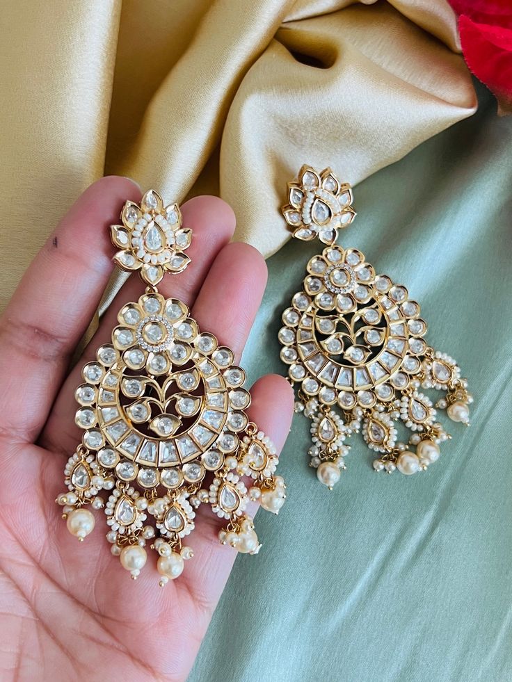 22k Gold plated Tayani chandbali Beads Stone Earrings.These 22k Gold plated Tayani chandbali Beads Stone Earrings exude elegance and luxury. The intricate design and high-quality materials make them a timeless accessory that will elevate any outfit. Experience the beauty and durability of these earrings, perfect for any occasion. Gold Plated Chandbali Tikka For Festivals, Festival Chandbali Gold-plated Tikka, Traditional Gold-plated Chandbalis For Celebration, Traditional Gold Plated Chandbalis For Celebration, Traditional Festive Chandbalis With Hand Set Details, Traditional Festive Hand Set Chandbalis, Festive Traditional Hand-set Chandbalis, Gold Plated Chandbali Chandelier Earrings As Gift, Festive Gold-plated Chandbalis Dangle Earrings