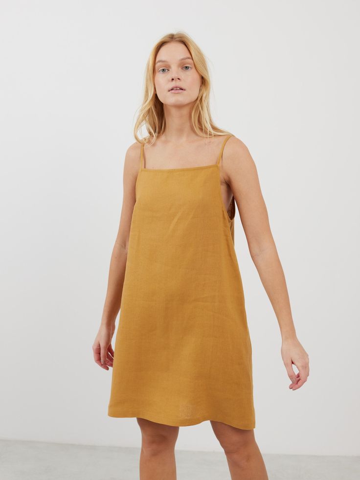 DEVON is a square neck strap mini linen dress which combines modern minimalism with a breathable fit, ideal for warm climates and summer events. Its sophisticated square neckline and a strap design make it versatile for both casual days and elegant evenings. DETAILS - Square neckline - Spaghetti straps - Mini length - 100% midweight European linen fabric - Cut and sewn to order just for you in our studio COLOR - Yellow Honey, you can also choose other colors above - Fabric samples are available Chic Linen Mini Dress With Square Neck, Spring Linen Mini Dress With Square Neck, Spring Square Neck Linen Mini Dress, Summer Mini Dress With Adjustable Straps And Straight Neckline, Square Neck Mini Dress With Adjustable Straps For Brunch, Cotton Sundress With Adjustable Straps And Straight Neckline, Casual Mini Dress With Square Neck And Adjustable Straps, Cotton Sundress With Square Neck Suspender, Chic Square Neck Linen Beach Dress