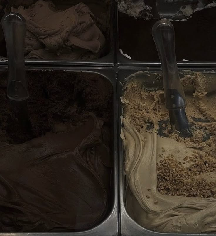 four pans filled with different types of ice cream and chocolate frosting in them