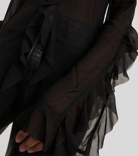 Ruffle perfection for your Insta feed. This Toulise blouse floats off the body with a cinched waist and fluttering 3/4 length ruffled sleeves. Semi-sheer black chiffon drapes elegantly from shoulder to hip making you look taller and leaner in pictures. Pair with your favorite jeans or skirt for effortless weekend style. Designed with breathability in mind, it's lightweight enough for warm weather yet polished enough for brunch. An elevating piece everyone will want to shop once they see it on yo Sheer Chiffon Blouse For Night Out, Fitted Blouse With Ruffle Hem For Night Out, Night Out Chiffon Blouse With Sheer Sleeves, Chiffon Blouse With Sheer Sleeves For Night Out, Formal Chiffon Blouse With Ruffles, Black Chiffon Blouse With Ruffles, Black Acne, Black Chiffon Blouse, Sheer Chiffon Blouse