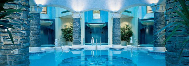 a woman is sitting in the middle of a swimming pool