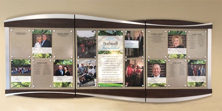 a wall display with several pictures on it