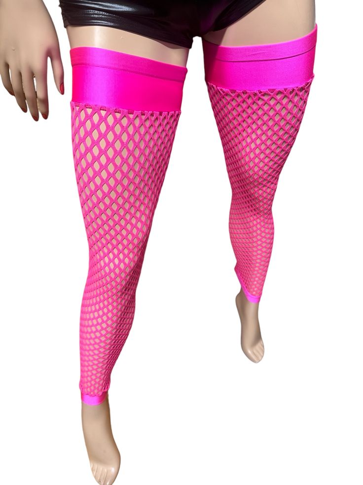 Add a touch of edgy sophistication to your outfit with these stylish thigh-high fishnet leg warmers. Made from high-quality fishnet material, these leg warmers are perfect for adding texture and interest to your look. Whether you're pairing them with boots or heels, these versatile leg warmers will keep you looking chic and feeling confident all day long. Upgrade your accessory game with these must-have thigh-high fishnet leg warmers today! They are designed to be pulled up towards the top of the leg.  There is a seam in the back of the leg. The bands at the top and bottom of the leggings are made with spandex fabric.  Sizes: XS fits thighs 18 to 20 inches around M fits thighs 20 to 22 inches around XL fits thighs 22 to 24 inches around Hand wash  Air dry Stretch Fishnet Mesh Stockings, Stretch Mesh Thigh High Hosiery, Stretch Fishnet Stockings For Summer, Thigh High Stretch Mesh Hosiery, Spring Stretch Fishnet Legwear, Trendy Stretch Mesh Hosiery, Trendy Tight Mesh Legwear, Thigh High Stretch Fishnet Stockings, Summer Thigh High Mesh Tights