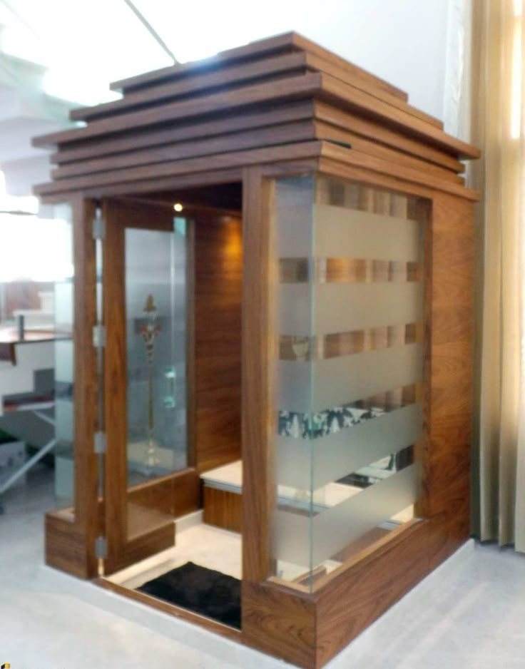 the inside of a wooden and glass display case