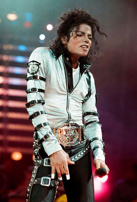 michael jackson performing on stage with his hands in his pockets