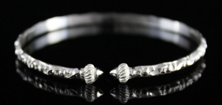 "Handmade in the West Indies this bracelet is solid sterling silver. The Taj Mahal heads are casted separately and soldered onto the patterned wire. Each item is stamped \".925\" or \"Sterling\" Sold as 1 side, they are approximately 1/8\" thick Sizes Bangles weigh between 7g - 10g Baby - 5\" circumference Baby/Child - 5 1/2\" circumference XSmall - 6 1/2\" circumference Small - 7\" circumference Medium - 7 1/2\" circumference About me: My father taught me to make bangles and I have been making Ornate Sterling Silver Bracelets With Silver Clasp, Ornate Sterling Silver Bracelets, Artisan Sterling Silver Jewelry With Jubilee Bracelet, Artisan Silver Jubilee Bracelet, Nickel-free White Gold Sterling Silver Bangle Bracelet, Nickel-free White Gold-toned Sterling Silver Bangle Bracelet, Traditional Sterling Silver Bracelets For Anniversary, Sterling Silver Engraved Bangle For Anniversary, Anniversary Sterling Silver Bangle With Silver Clasp