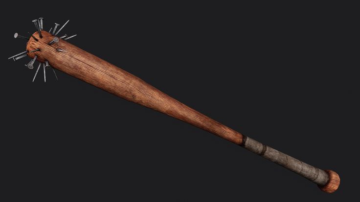 a wooden baseball bat with metal spikes on it