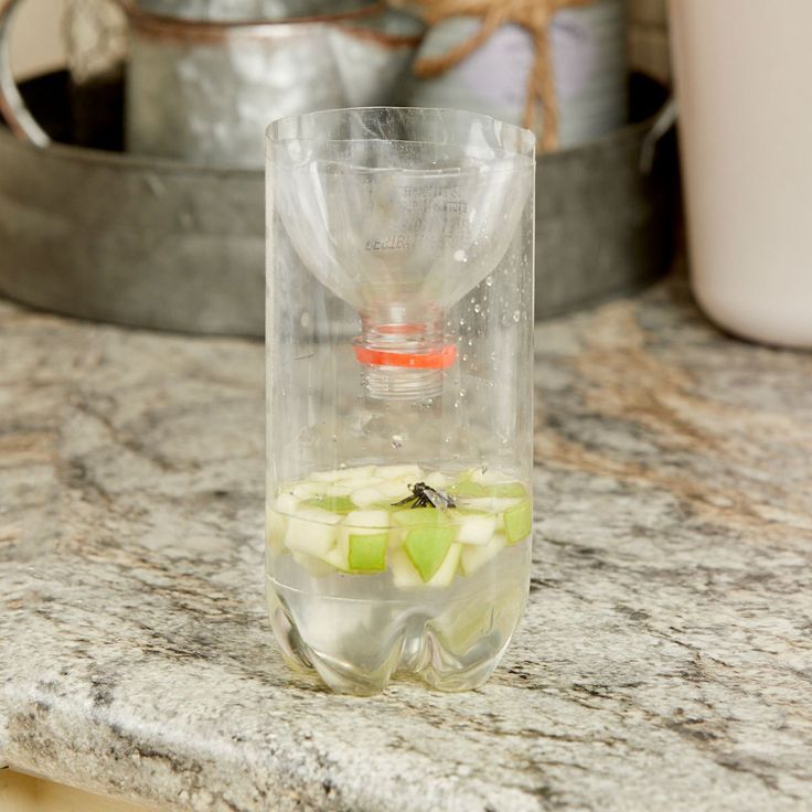 a glass filled with liquid sitting on top of a counter