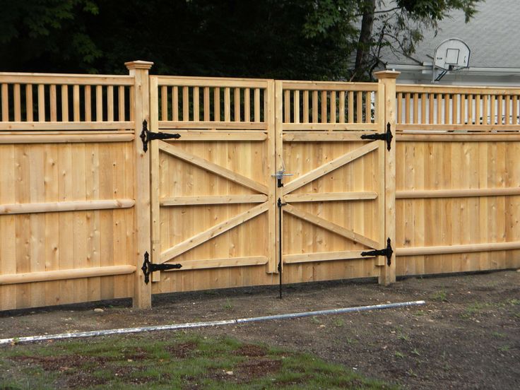 an image of a wooden fence with gates