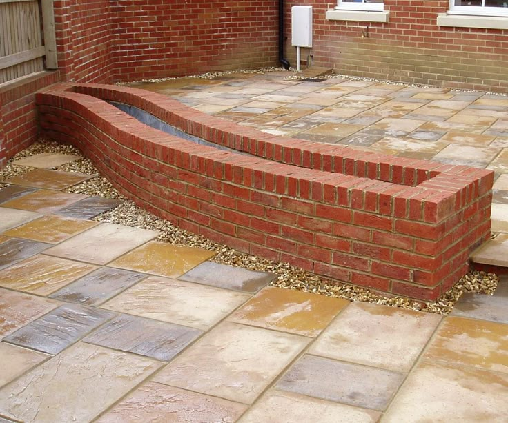 a brick patio with steps leading up to it