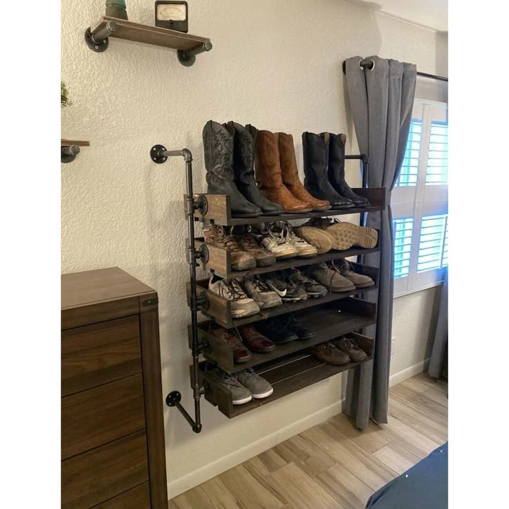 there are many pairs of shoes on the shelf