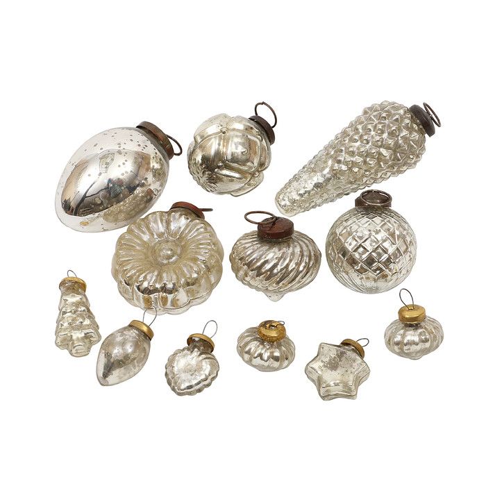 an assortment of glass ornaments on a white background