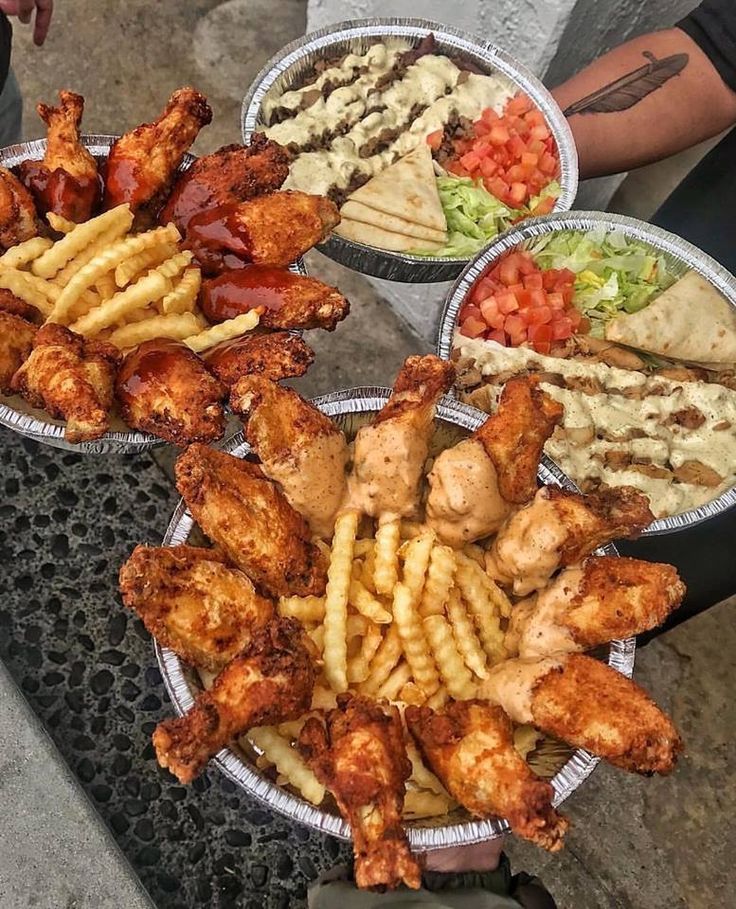 three bowls filled with different types of food