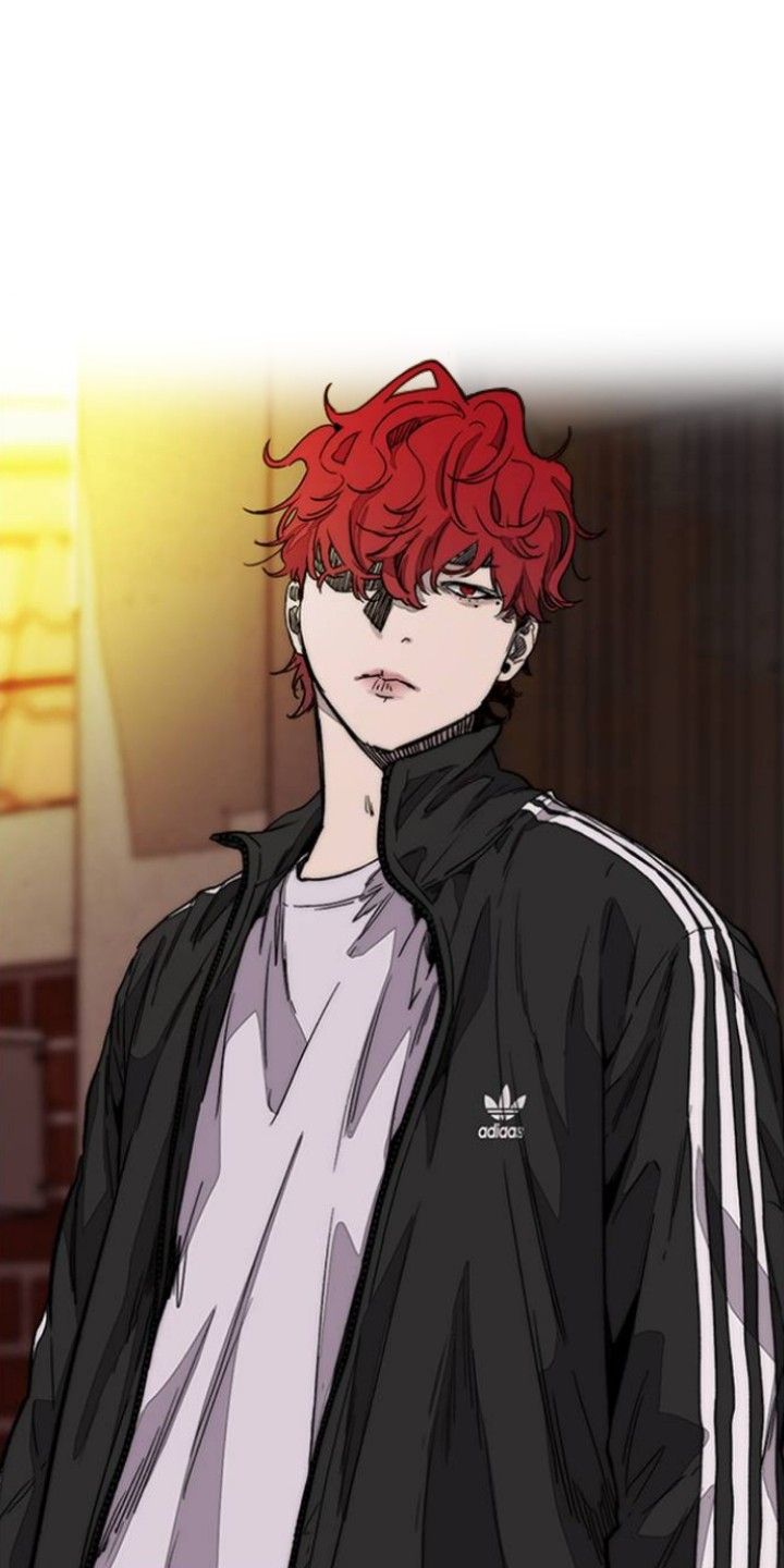 a man with red hair wearing a black jacket