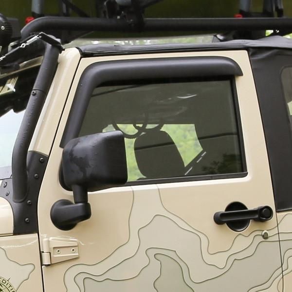 the front view of a white jeep with camouflage print on it's side window