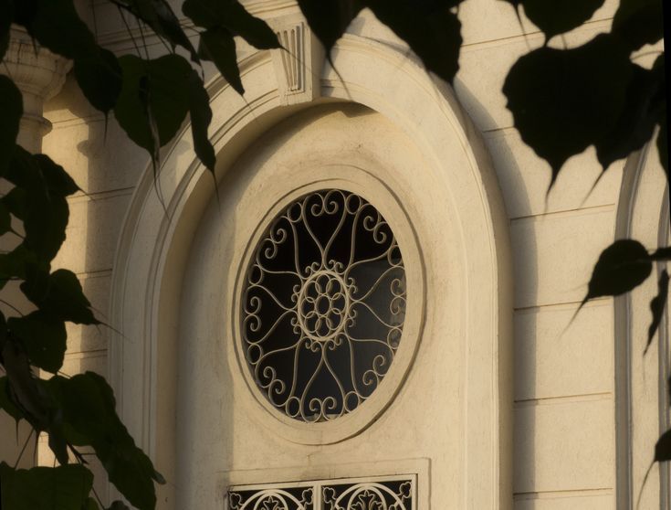 an ornate window on the side of a building